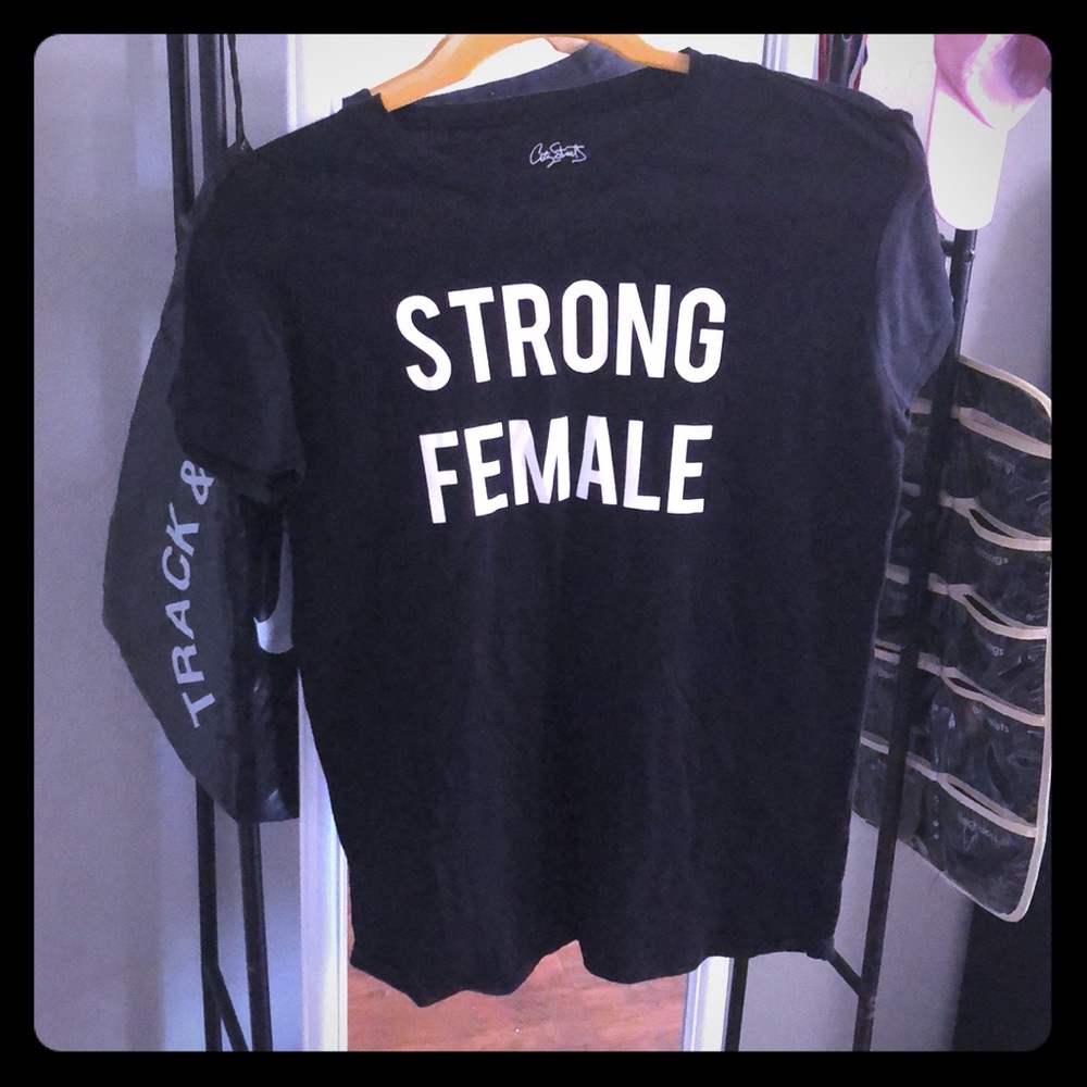 “Strong female” black tee.
